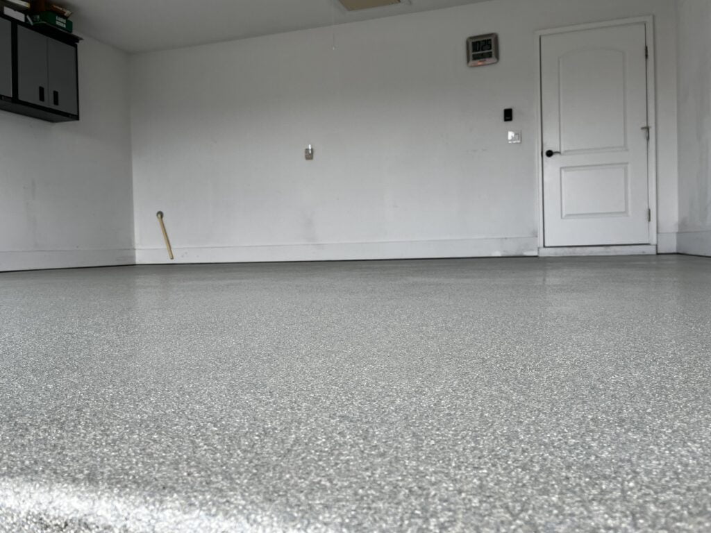 Expert epoxy garage flooring being installed 