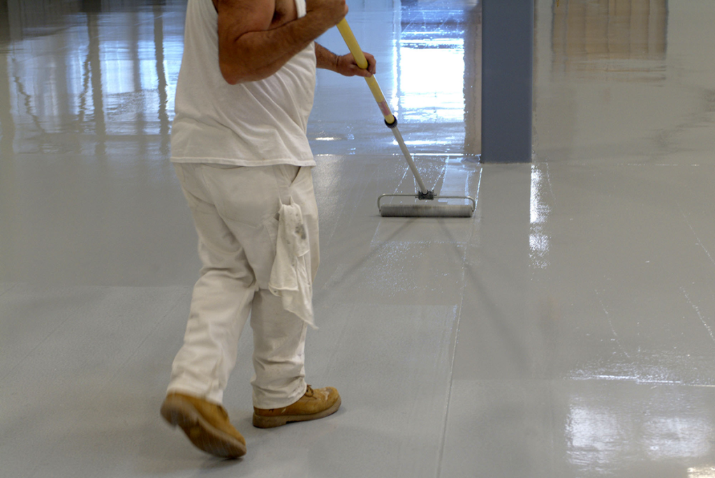 Expert epoxy garage flooring being installed